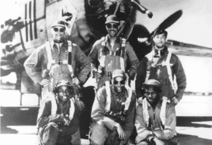 Tuskegee Airmen Freemen Field Bomber Crew in front of airplane