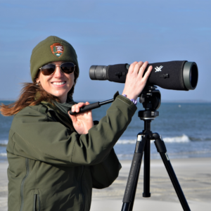 Ranger Amy on the lookout with telescope on Cape Hatteras National Seashore