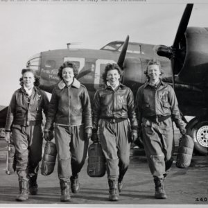 Four Women Airforce Service Pilots in front of airplane during World War II