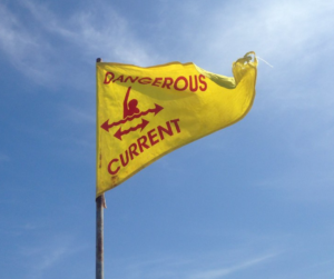 Yellow Dangerous Current Flag on the Beach
