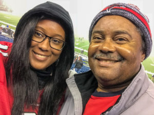 Rebekah and her dad at an Atlanta Falcons football game.
