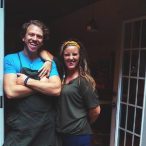 Adrian and Katie Amabile standing outside of their home studio in South Carolina. 