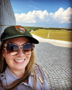 Ranger Taylor in front of the Wright Brothers Monument at Wright Brothers National Memorial.
