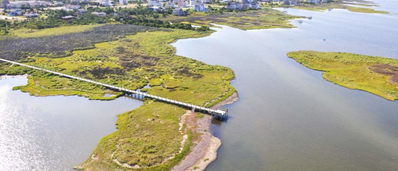 An aerial photograph of a boardwalk and kayak launch in Salvo, North Carolina.