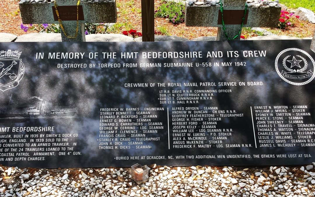 An Illustration and description of the HMT Bedfordshire and the names of the lost crew members etched into a memorial stone at the British Cemetery in Ocracoke.