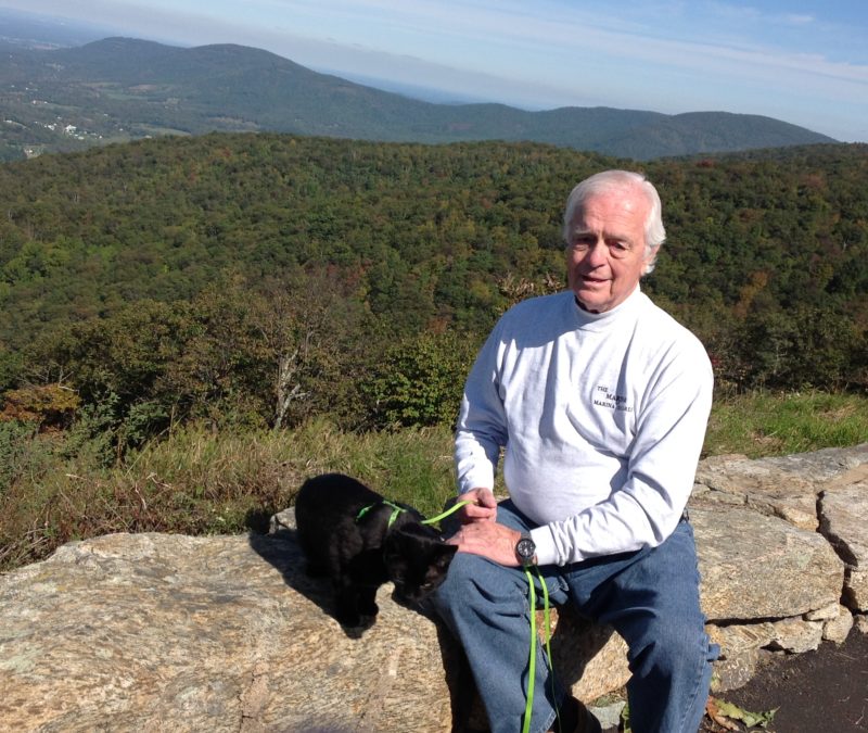 Thurman Worthington, Jr., and his pet cat on the Blue Ridge Parkway.